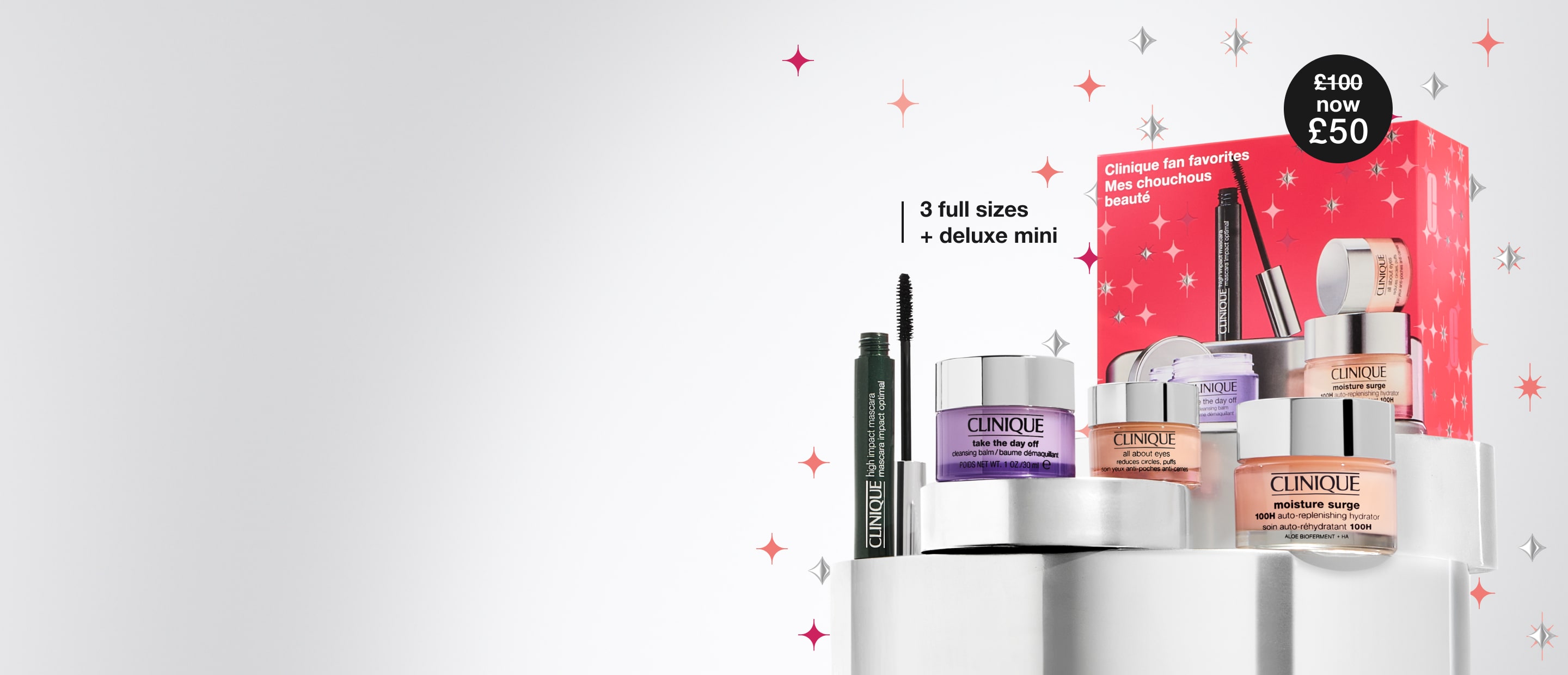 Clinique Fan Favourites Gift Set on a grey plinth, in a brightly lit setting, surrounded by pink and silver star graphics