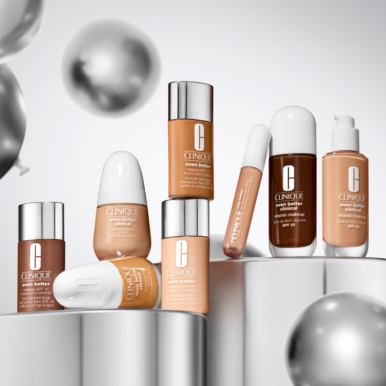 Selection of new brow and eye products dynamically placed on a glass shelf, in a brightly lit studio setting